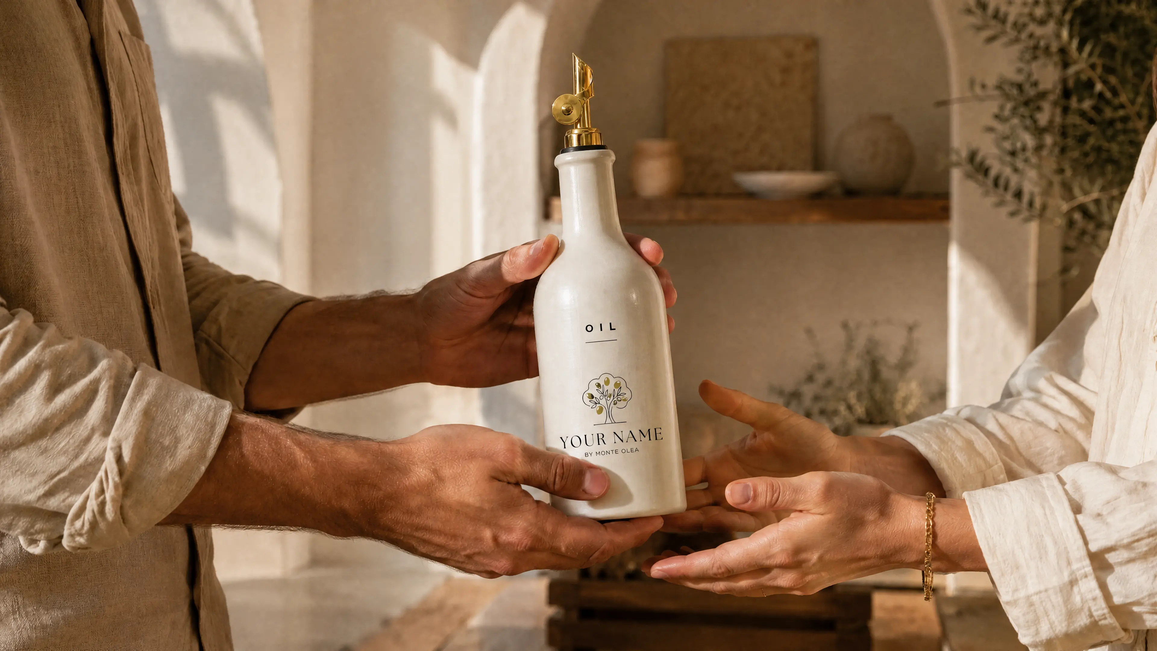 Two people passing a personalized ceramic olive oil bottle as a gift